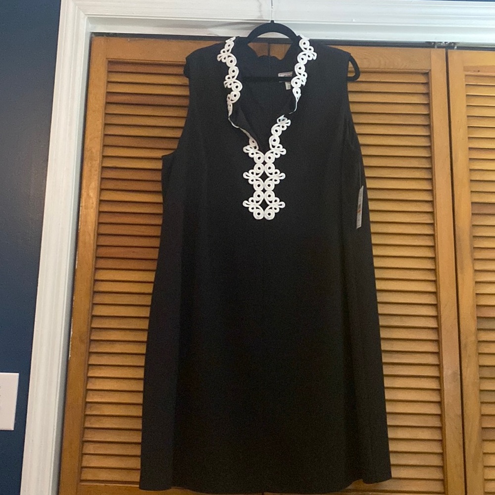 Black sleeveless dress with white embroidered  neck detailing